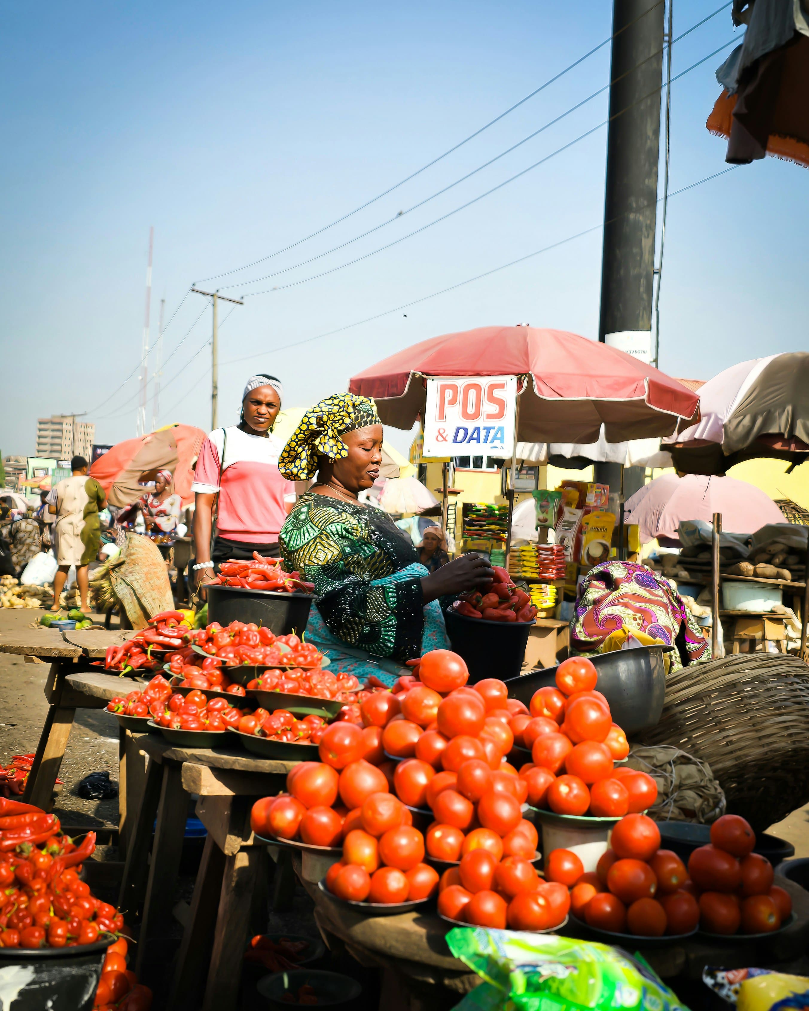 African marketplace with vendors selling fresh produce